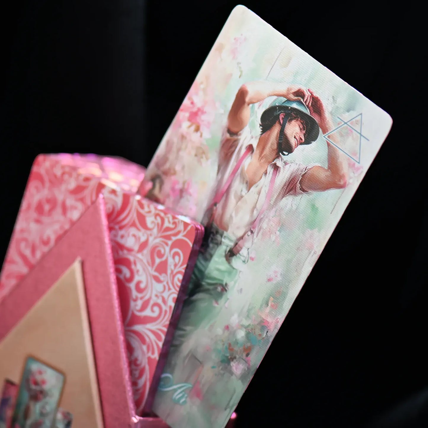 Colorful tarot card with artistic design on a black background