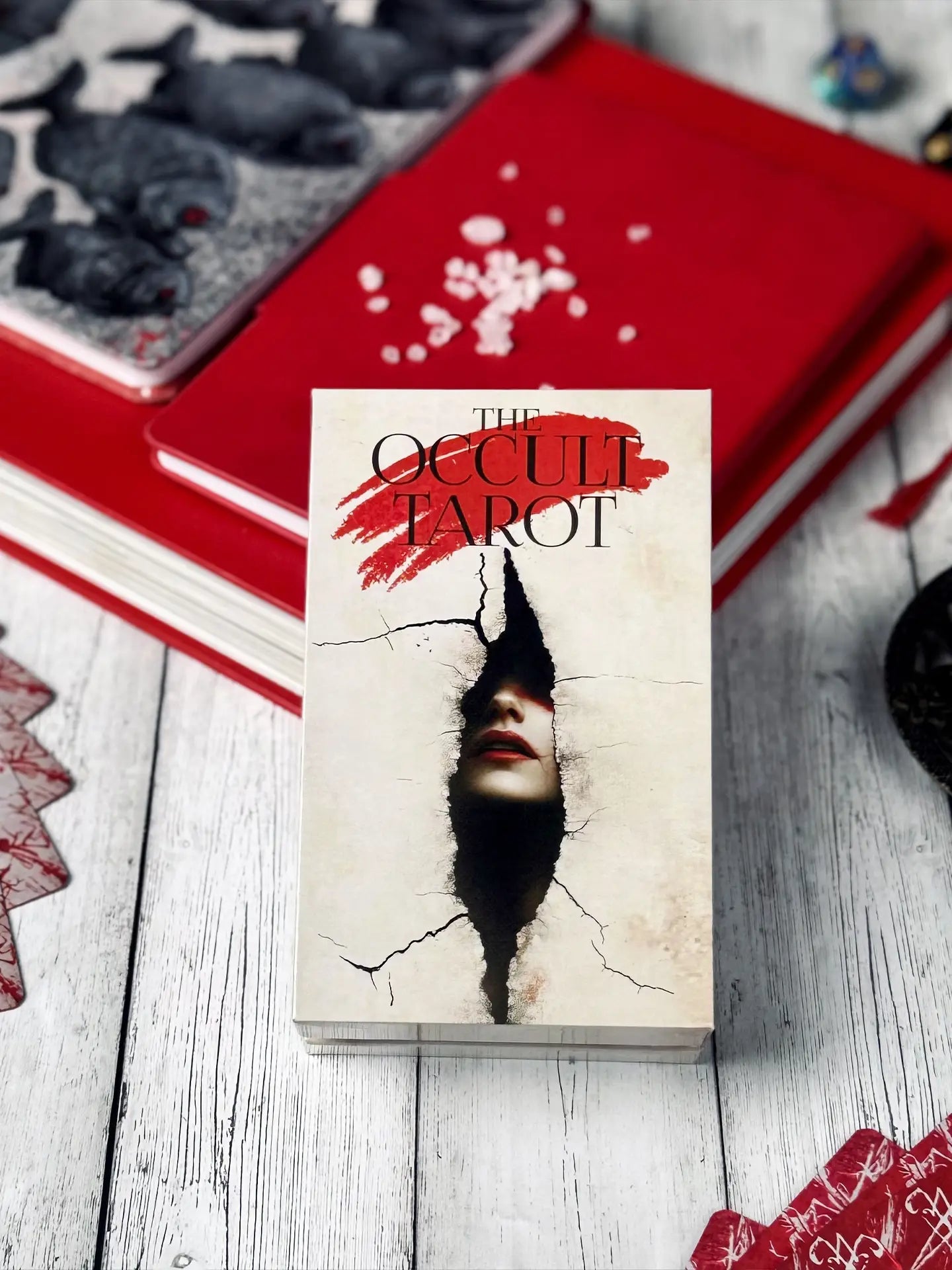 Tarot Box titled 'The Occult Tarot' with a cracked cover design on a wooden surface.