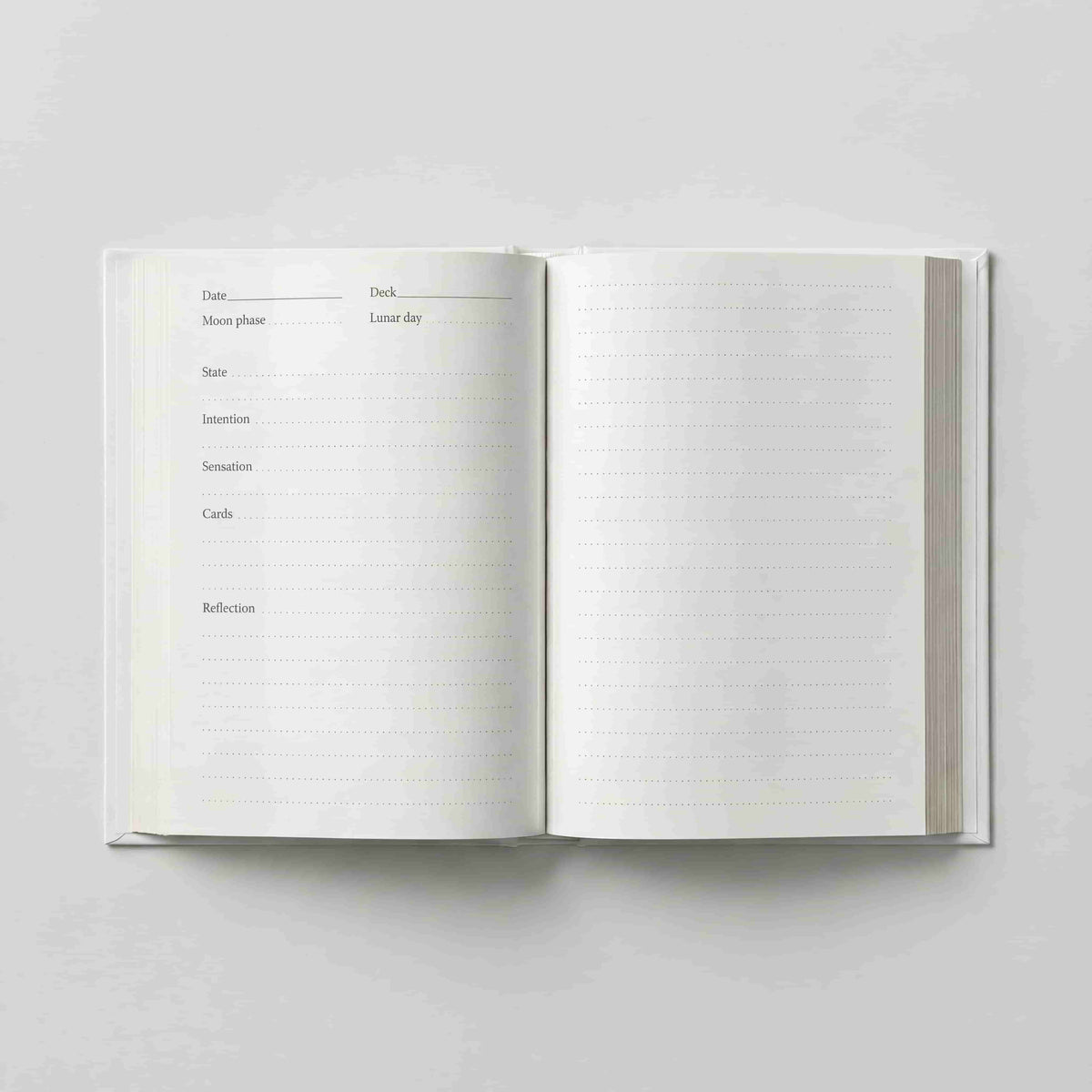 Open pages of the Inner Reflection tarot journal with prompts for intention, cards and reflection