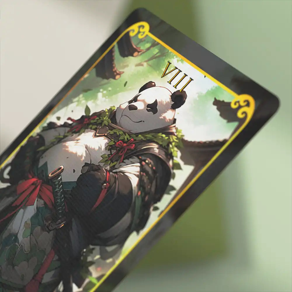 Close-up shot of a panda warrior card from the Animasoul Tarot Deck, showing fine linen texture and vivid colors