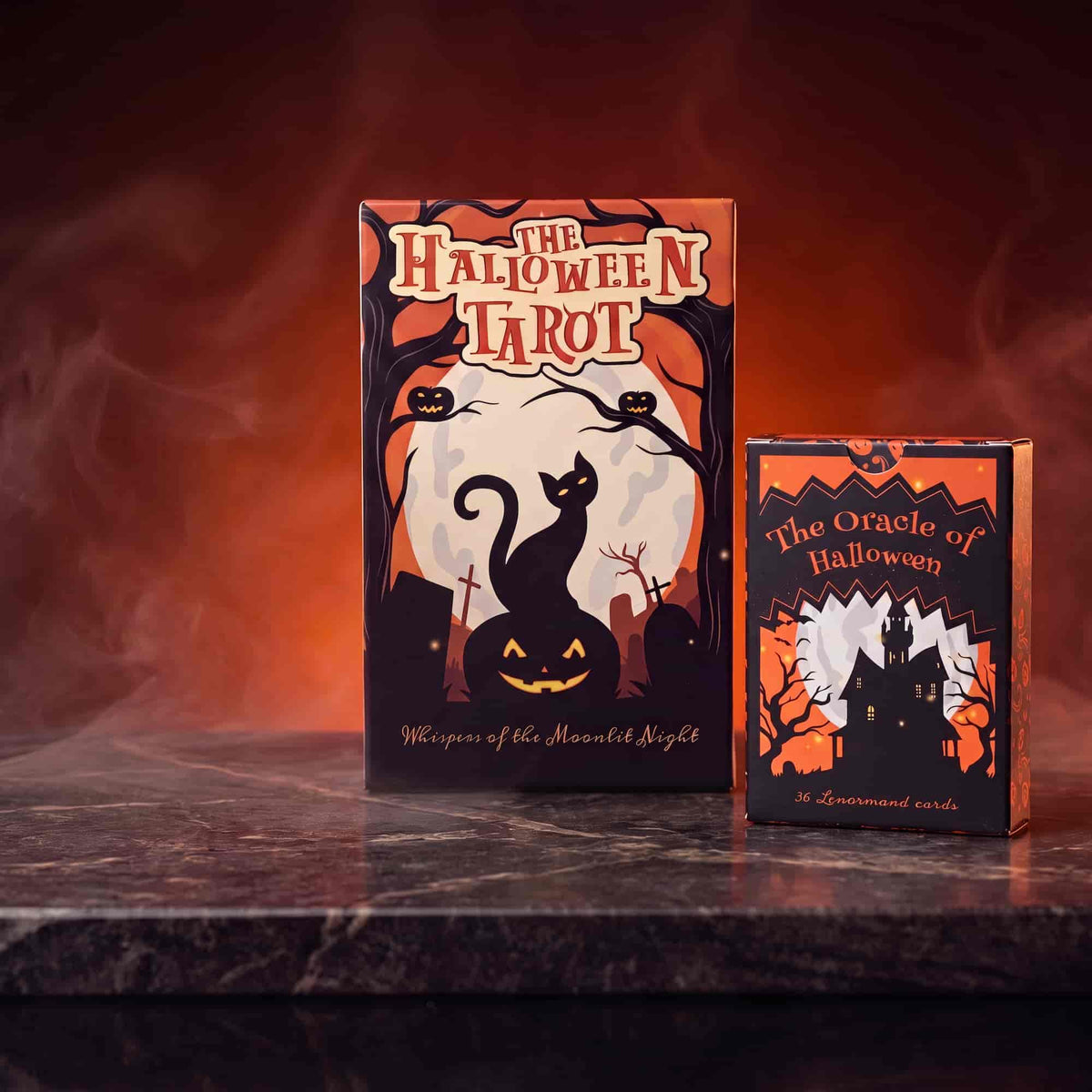 The Halloween Tarot box and The Oracle of Halloween 36-card Lenormand deck on dark marble