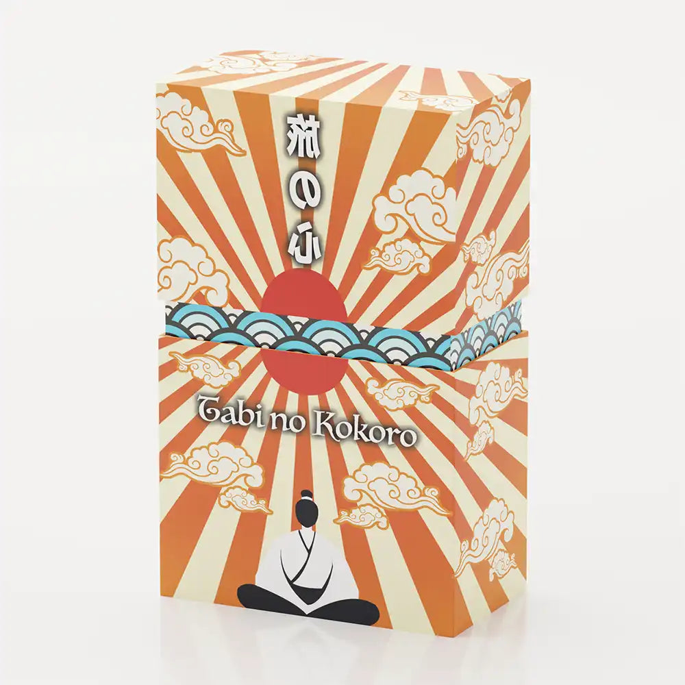 Box of the Tabi no Kokoro tarot deck, designed with rising sun rays and Japanese cloud motifs in red, orange, and cream tones.
