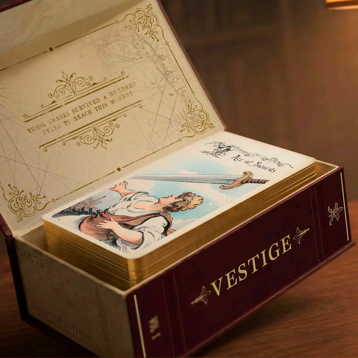 Vestige Tarot collector edition box open with Ace of Swords card on gold gilded deck