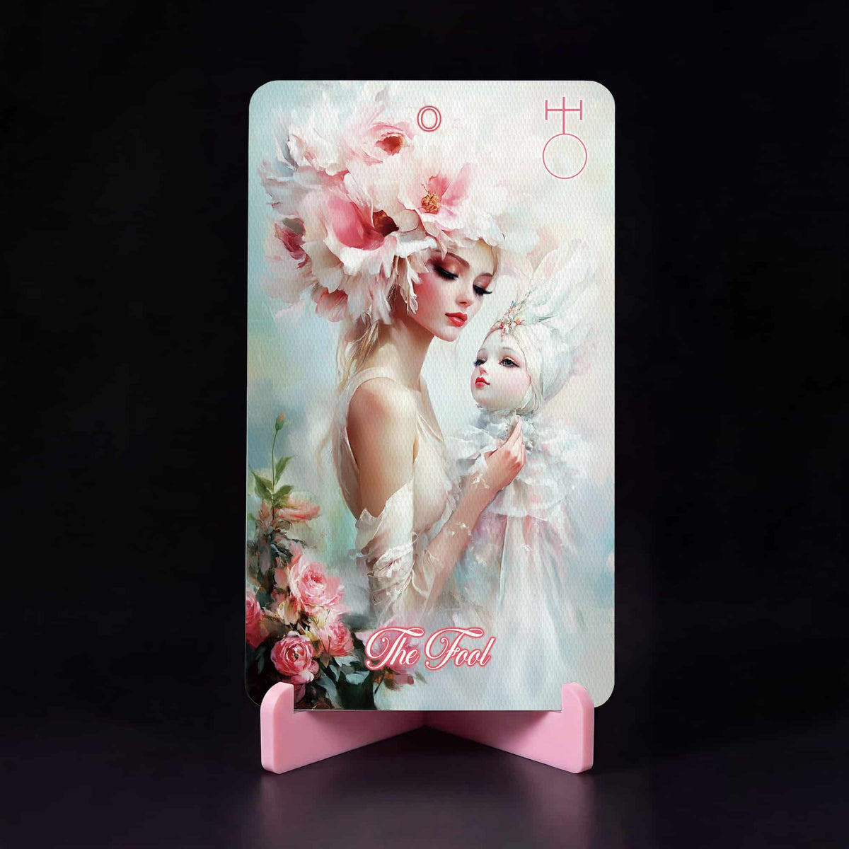 La Petite Flamme Tarot The Fool card, woman with pink flower crown holding a porcelain doll
