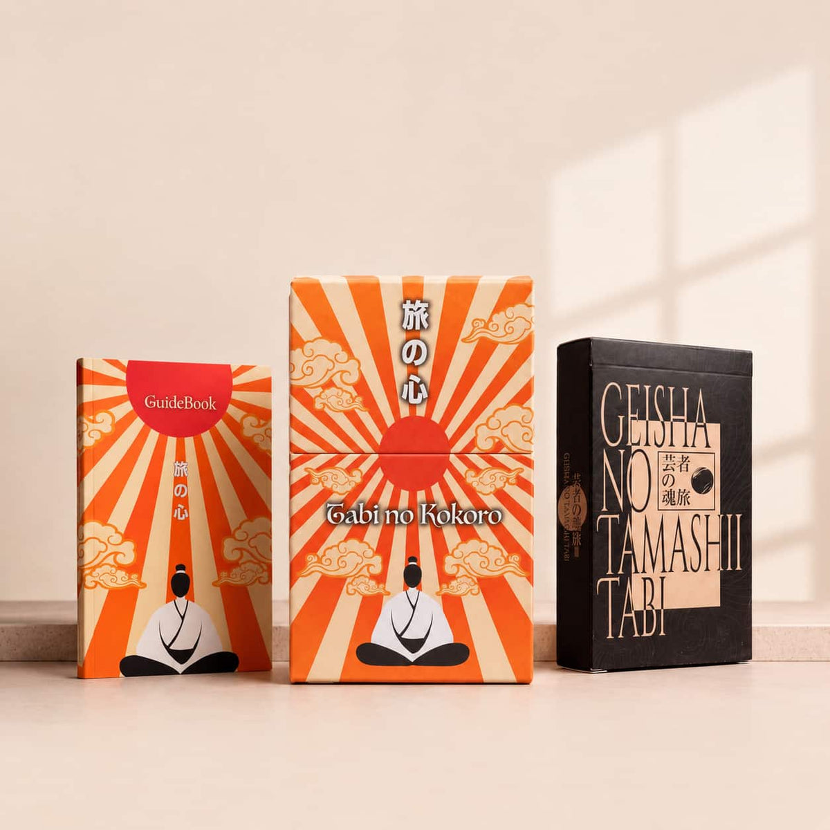 Tabi no Kokoro Tarot box and guidebook next to Geisha no Tamashii Tabi Lenormand deck box