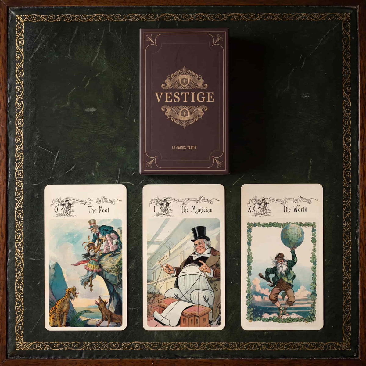 Vestige Tarot box with The Fool, The Magician and The World cards on a green leather desk