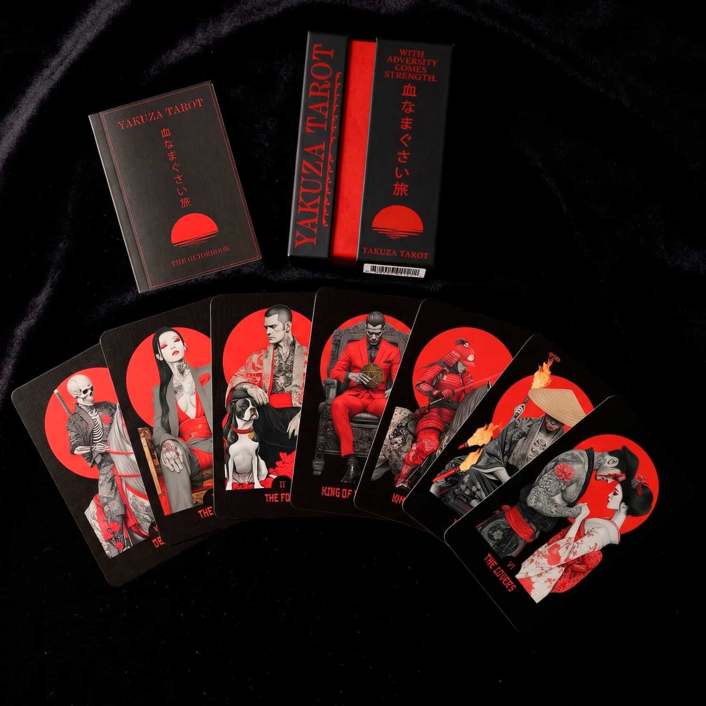 Yakuza Tarot cards, box and guidebook with red and black design on a dark background