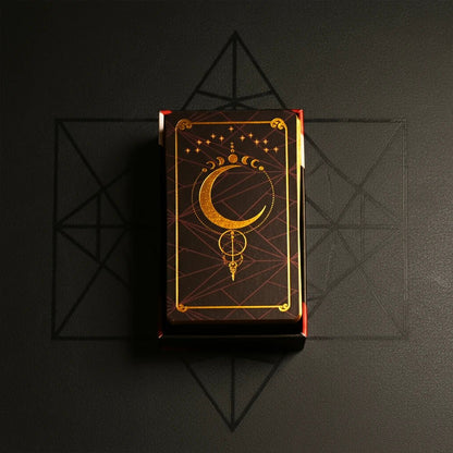 AnimaSoul Tarot deck box top, gold foil crescent moon design on dark red
