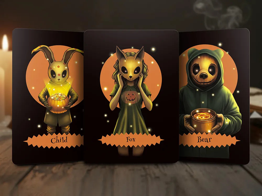 Three Halloween Oracle Lenormand cards showing Child, Fox, and Bear characters with glowing details