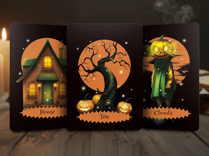 Three Halloween Oracle Lenormand cards showing House, Tree, and Clouds with glowing pumpkin elements