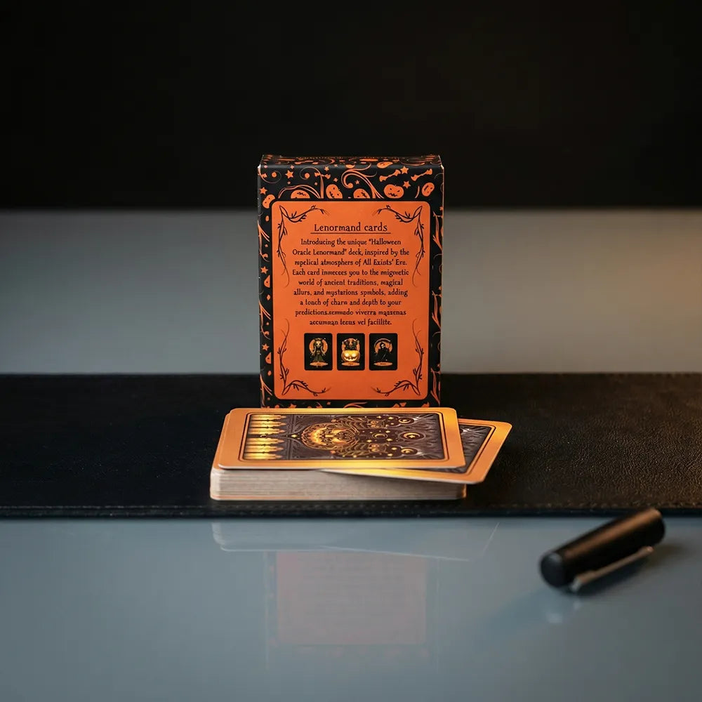 Back of Halloween Oracle Lenormand deck box with cards displayed on a dark surface