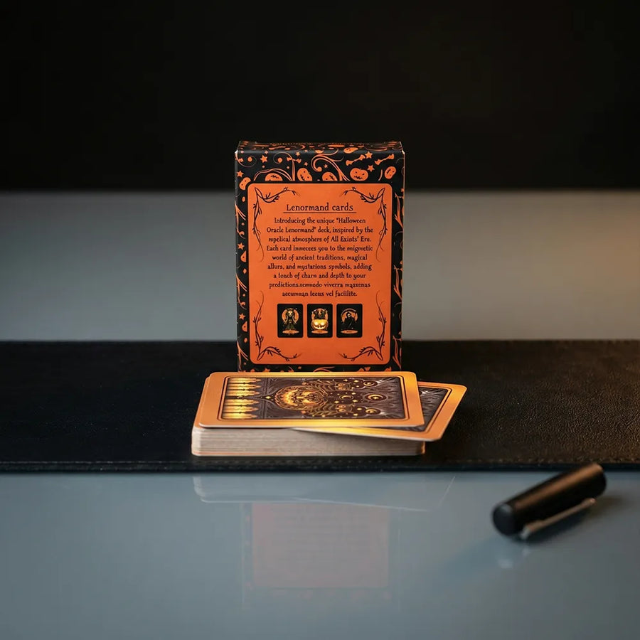 Back of Halloween Oracle Lenormand deck box with cards displayed on a dark surface