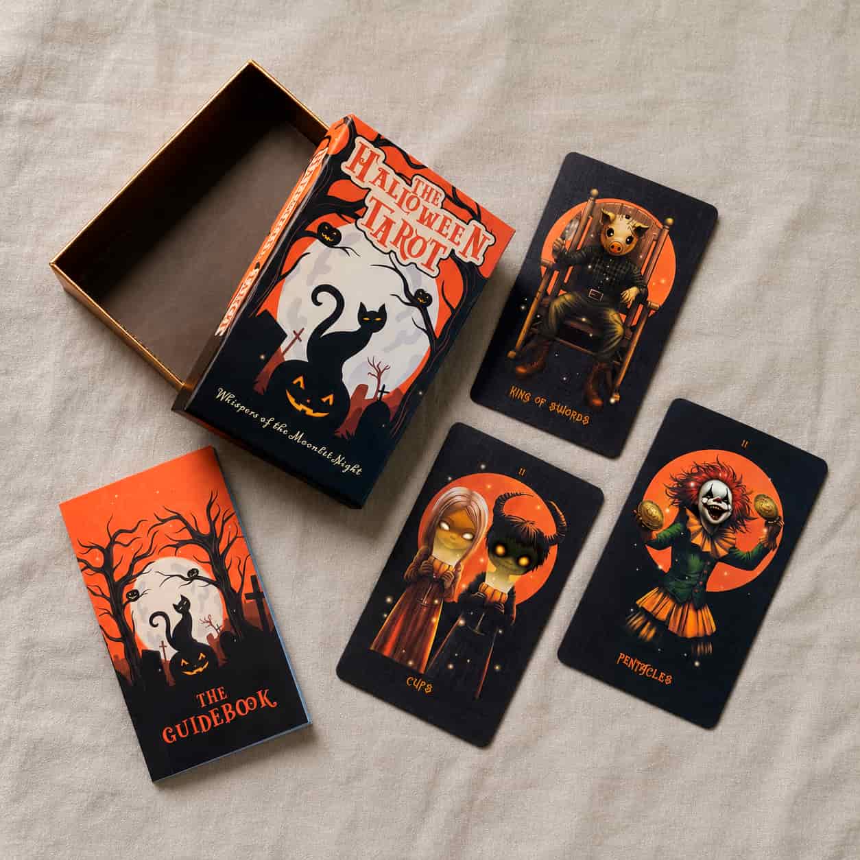 Halloween Tarot complete set with collector box, printed guidebook and tarot cards displayed on linen fabric