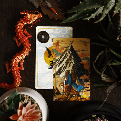 Journey to the West Tarot The Hermit card, old monk walking past a mountain, with card back and dragon figurine