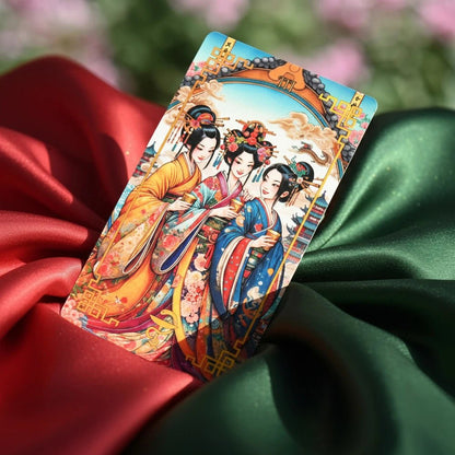 Journey to the West Tarot Three of Cups card, three women in kimonos raising cups, on red and green satin