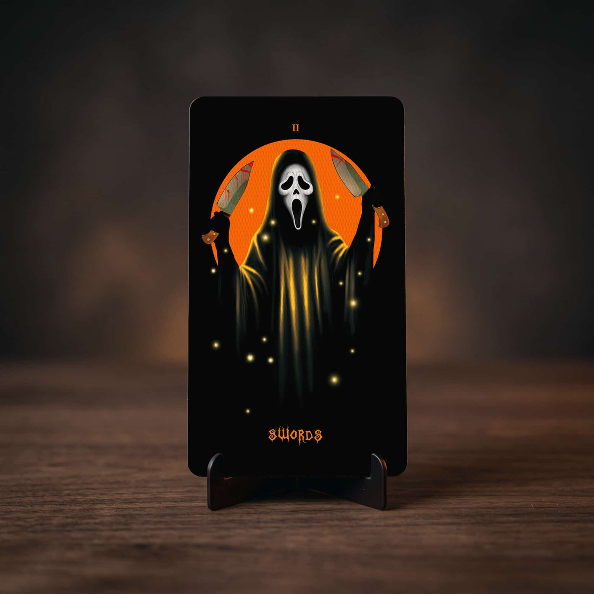 Halloween Tarot Two of Swords card, hooded screaming-mask ghost holding two knives