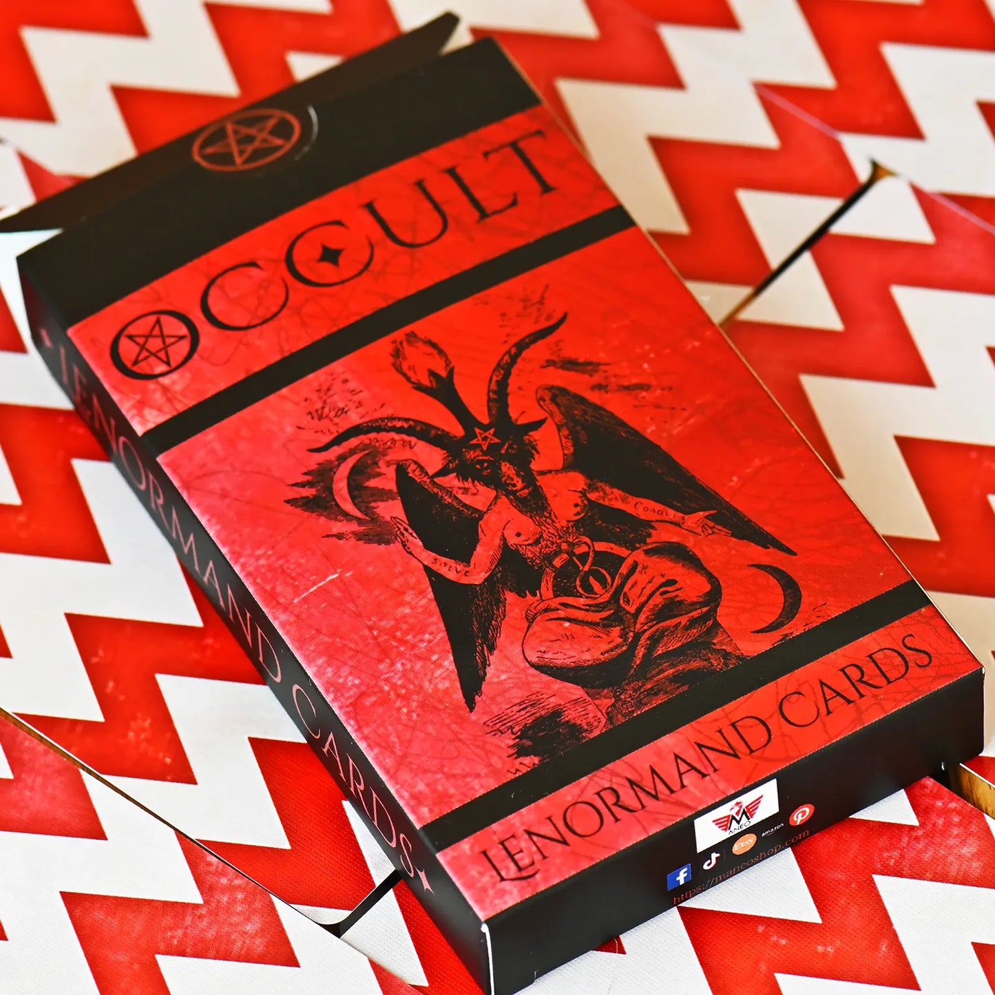 Red and black box of Occult Lenormand Cards on a red and white chevron patterned background
