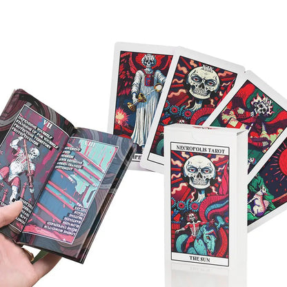 Necropolis Tarot box, guidebook and Temperance, The Sun and Moon cards with skeleton artwork