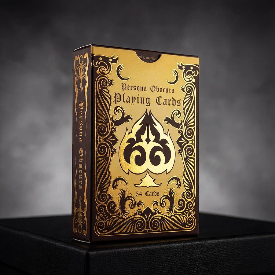 Persona Obscura Playing Cards box with gold foil baroque frame and spade emblem