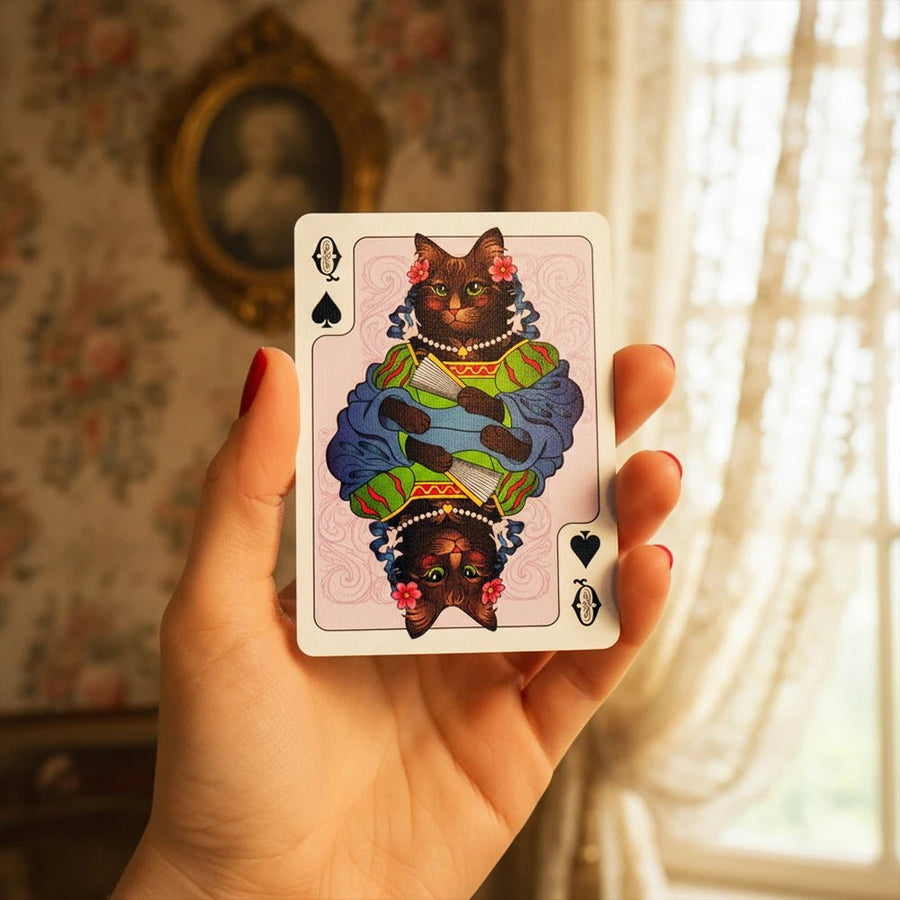 Cats Century Queen of Spades playing card, cat in a vintage dress, held in hand