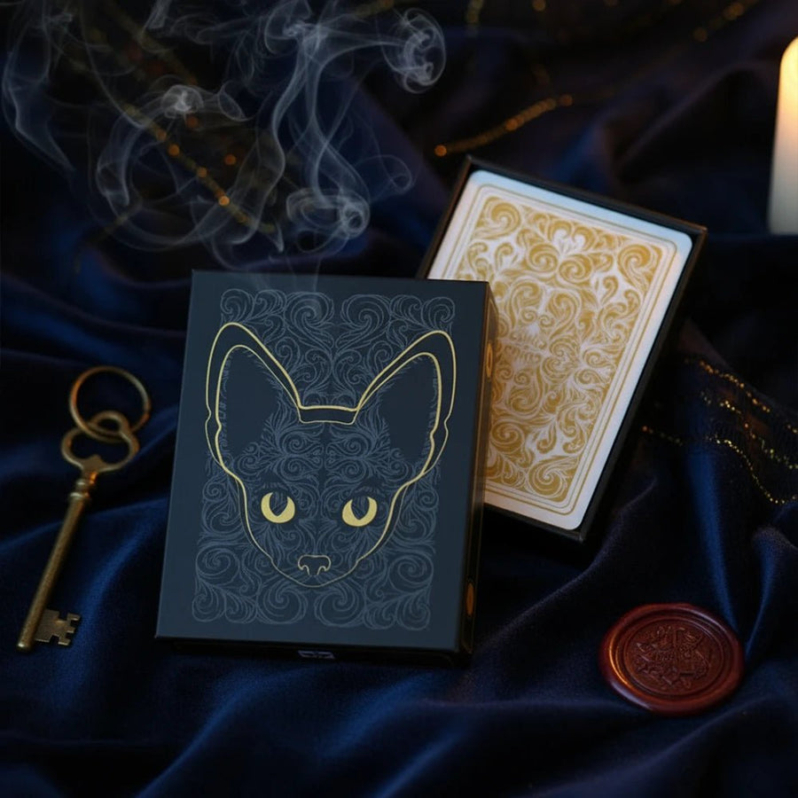 Cats Century playing cards, black box with gold foil cat face and cream-and-gold ornate card backs