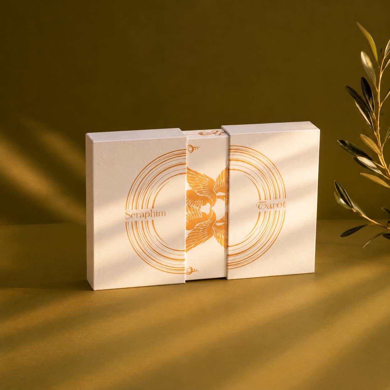 Seraphim Tarot two-piece collector packaging opened to reveal the inner magnetic box with gold foil artwork.