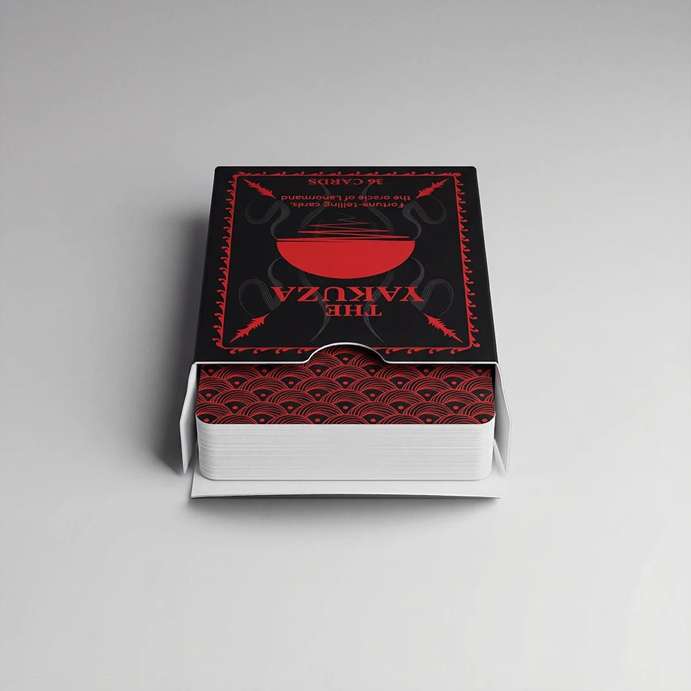 Open Yakuza Lenormand deck box showing card backs with red wave pattern on a clean background