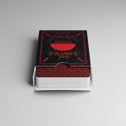 Open Yakuza Lenormand deck box showing card backs with red wave pattern on a clean background