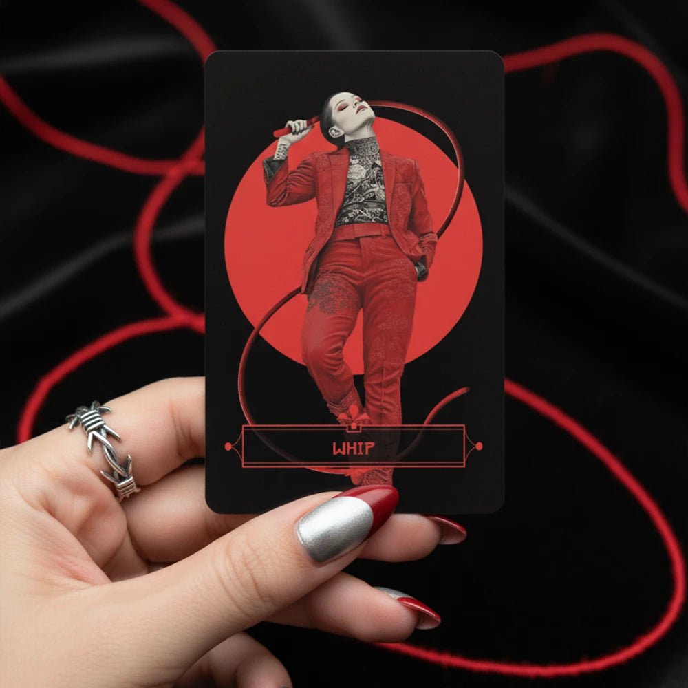 Hand holding Yakuza Lenormand Whip card featuring a woman in red suit with bold red and black design
