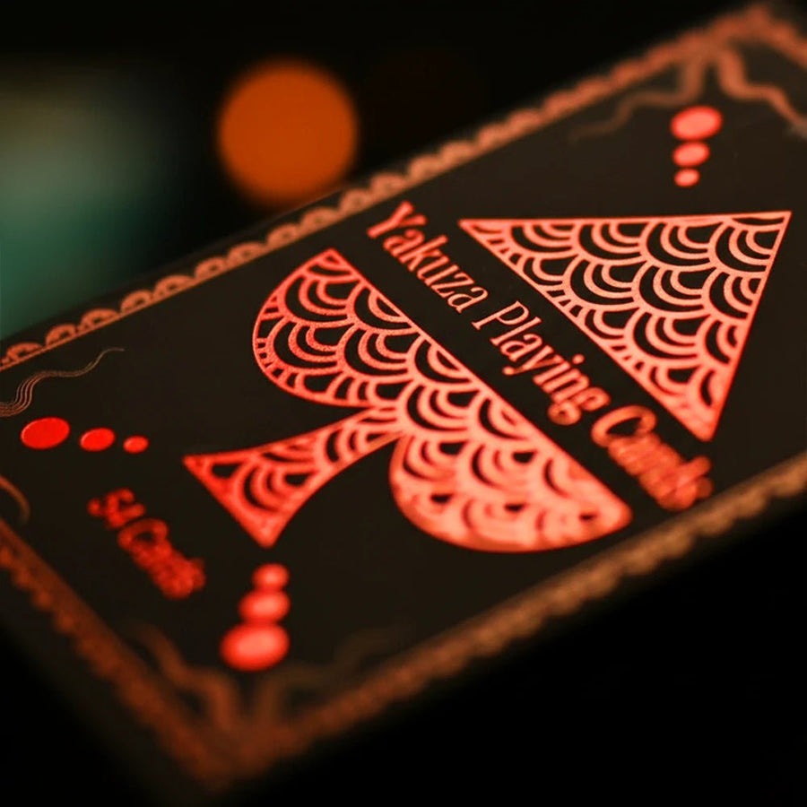 Yakuza Playing Cards box close-up, red foil spade with Japanese wave pattern on matte black