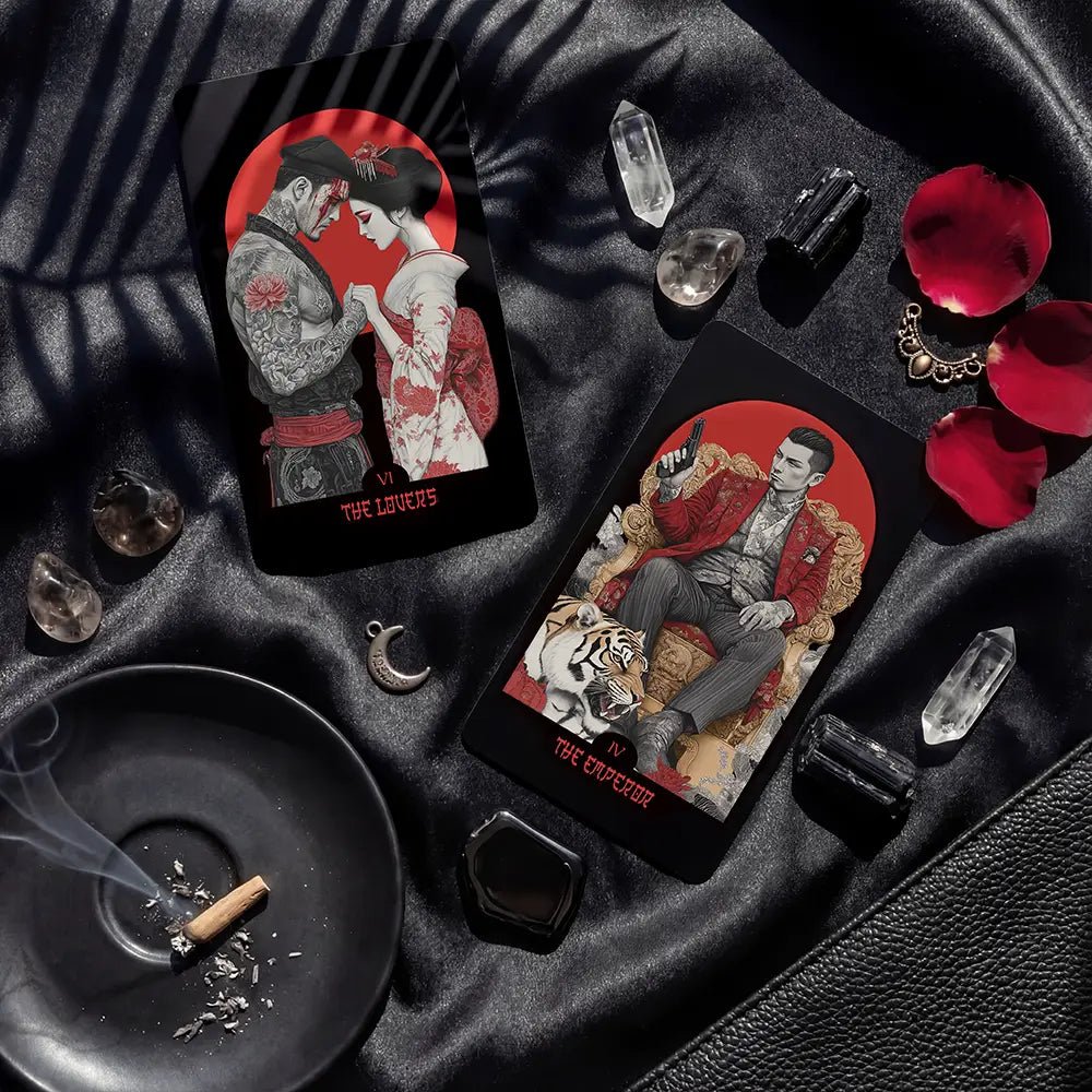 Yakuza Tarot Lovers and Emperor cards on black silk with crystals, petals and moody lighting